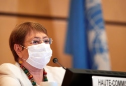 FILE - U.N. High Commissioner for Human Rights Michelle Bachelet is seen at a session of the Human Rights Council at the European headquarters of the United Nations in Geneva, Switzerland, June 30, 2020.