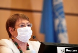 FILE - U.N. High Commissioner for Human Rights Michelle Bachelet attends the 44th session of the Human Rights Council at the European headquarters of the United Nations in Geneva, Switzerland, June 30, 2020.