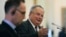 Greek Foreign Minister Nikos Kotzias, right, answers questions next to his German counterpart Heiko Maas during a joint press conference after their meeting in Athens, Greece, Sept. 20, 2018.