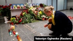 UKRAINE – Relatives of the flight crew members of the Ukraine International Airlines Boeing 737-800 plane that crashed in Iran, mourn at a memorial at the Boryspil International airport outside Kyiv, January 8, 2020