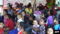 Myanmar people displaced from the recent fighting between government troops and ethnic Arakan Army take shelter at a displacement camp housing over 700 people in Kyauktaw township in Rakhine state on December 23, 2018. 