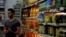 A man waits for customers at a grocery store in Cairo, Egypt, Oct. 26, 2016.
