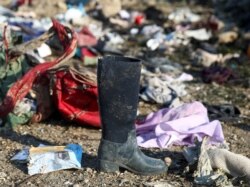 Passengers' belongings are pictured at the site where the Ukraine International Airlines plane crashed after take-off from Iran's Imam Khomeini airport, on the outskirts of Tehran, Iran Jan. 8, 2020.