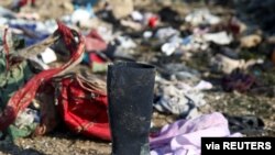 Passengers' belongings are pictured at the site where the Ukraine International Airlines plane crashed after take-off from Iran's Imam Khomeini airport, on the outskirts of Tehran, Iran January 8, 2020. Nazanin Tabatabaee/WANA (West Asia News Agency…