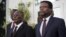 Haiti's provisional president Jocelerme Privert (L) and appointed prime minister Fritz Jean listen to the national anthem at Jean's inauguration ceremony in the National Palace in Port-au-Prince, Haiti, Feb. 26, 2016. 