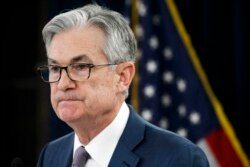 FILE - In this Tuesday, March 3, 2020 file photo, Federal Reserve Chair Jerome Powell pauses during a news conference to discuss an announcement from the Federal Open Market Committee, in Washington. In a series of sweeping steps, the U.S. Federal…