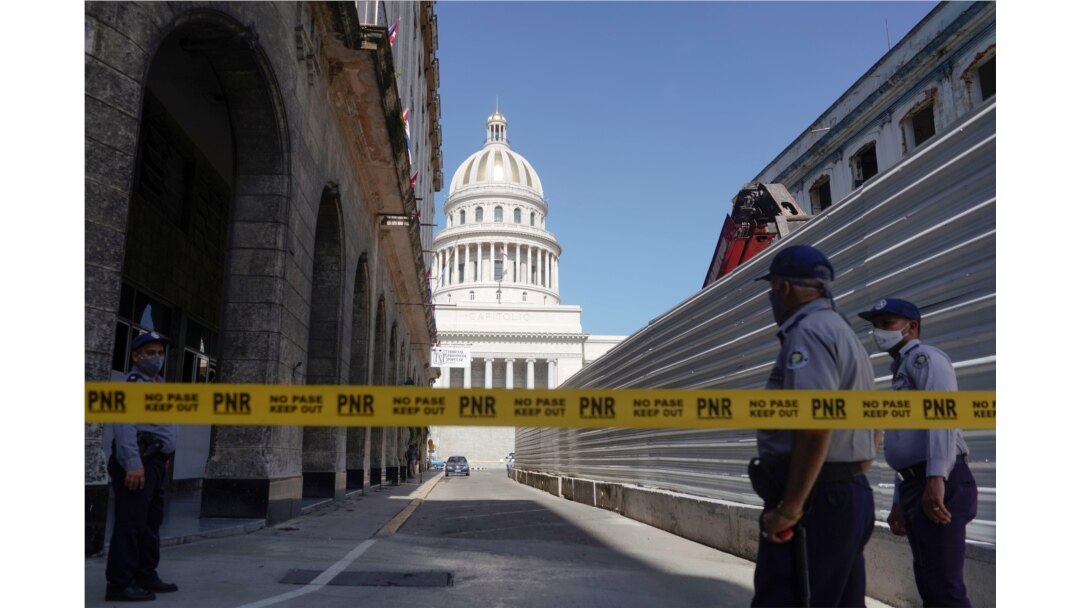 A police line is seen blocking a road leading to the National Capitol Building, in Havana, Cuba, July 12, 2021.