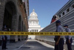 A police line is seen blocking a road leading to the National Capitol Building, in Havana, Cuba, July 12, 2021.