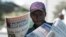 A vendor sells the privately-owned Daily News newspaper in Harare, March 18, 2011