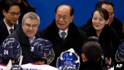 FILE - IOC president Thomas Bach, second from left, and Kim Yo Jong, right, sister of North Korean Leader Kim Jong Un.