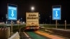 FILE - A truck from Britain drives through a customs area to enter France at the Eurotunnel terminal, in Coquelles, northern France, Jan. 1, 2021.