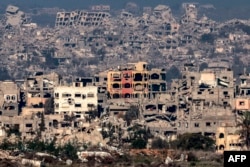 This picture taken from the Israeli side of the border with the Gaza Strip shows destroyed buildings in northern Gaza on Jan. 13, 2025.