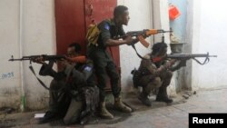 FILE - Somali security forces hold their positions near the mayor's office following a blast in Mogadishu, Somalia, on Jan. 22, 2023. The Somali government claimed on Oct. 4, 2023, that its troops had killed hundreds of al-Shabab militants in the past two months.