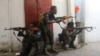 FILE - Somali security forces hold their positions near the mayor's office following a blast in Mogadishu, Somalia, Jan. 22, 2023. Authorities reported that at least 20 al-Shabab militants were killed in a military strike in central Somalia on Jan. 25, 2024.