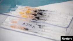 Syringes with AstraZeneca coronavirus disease (COVID-19) vaccines are prepared in Fasano, Italy, Apr. 13, 2021.