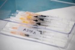 Syringes with AstraZeneca coronavirus disease (COVID-19) vaccines are prepared in Fasano, Italy, Apr. 13, 2021.
