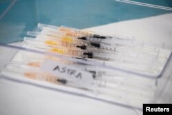 Syringes with AstraZeneca coronavirus disease (COVID-19) vaccines are prepared in Fasano, Italy, Apr. 13, 2021.