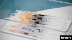 Syringes with AstraZeneca coronavirus disease (COVID-19) vaccines are prepared in Fasano, Italy, Apr. 13, 2021.