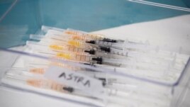 Syringes with AstraZeneca coronavirus disease (COVID-19) vaccines are prepared in Fasano, Italy, Apr. 13, 2021.