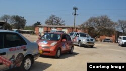 Cars plastered with anti-meter posters in Bulawayo.