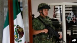 A soldier stands guard at Talleres Graficos de Mexico, where election ballots are printed in Mexico City, May 6, 2018. The National Electoral Institute initiated the printing of ballots that will be used to elect Mexico's congress, senate and president on