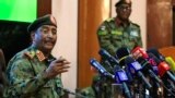 FILE - Sudan's top army general Abdel Fattah al-Burhan speaks during a press conference at the General Command of the Armed Forces in Khartoum on Oct. 26, 2021.