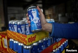 FILE PHOTO: Nato-branded OTAN beer cans by Olaf Brewing Company are pictured in Savonlinna