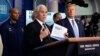 FILE - Vice President Mike Pence speaks as President Donald Trump listens during a press briefing with the coronavirus task force, at the White House, March 16, 2020, in Washington.