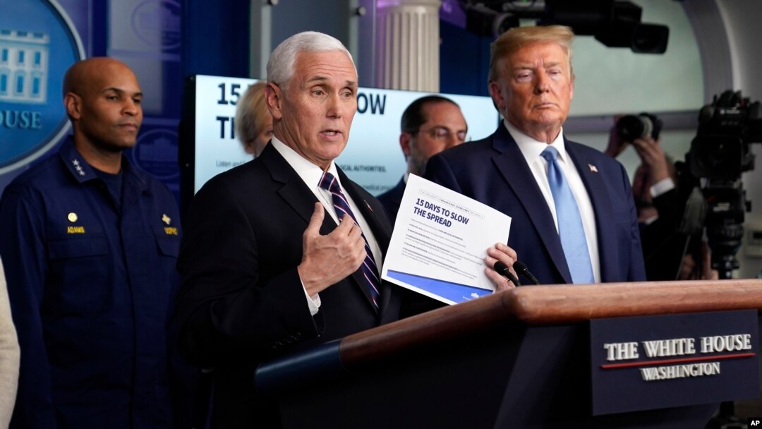 FILE - Vice President Mike Pence speaks as President Donald Trump listens during a press briefing with the coronavirus task force, at the White House, March 16, 2020, in Washington.