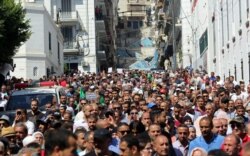 Demonstrators gather during a protest demanding social and economic reforms, as well as the departure of the country's ruling elite in Algiers, Algeria, Sept. 24, 2019.