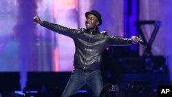 FILE - Singer-songwriter Aloe Blacc is seen performing on stage.