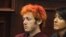 Colorado shooting suspect James Eagan Holmes (L) sits with public defender Tamara Brady during his first court appearance in Aurora, Colorado, July 23, 2012. Holmes, the man accused of shooting dead 12 people in a Colorado movie theater during the midnigh