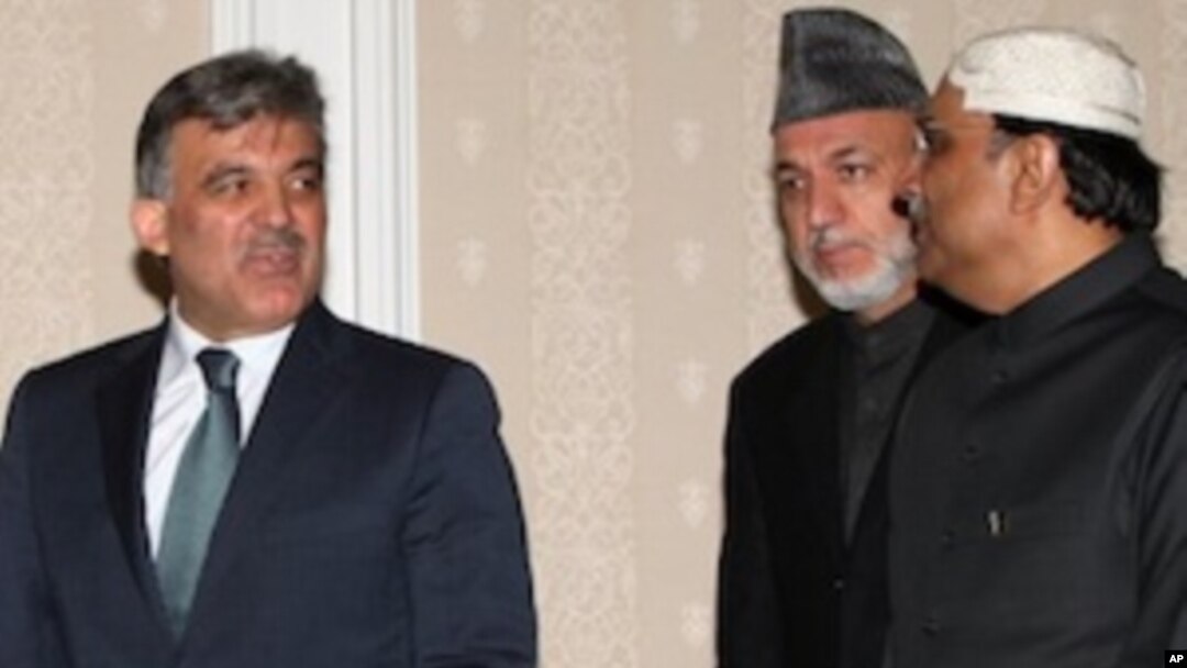 President of Turkey Abdullah Gul, left, and his counterparts Hamid Karzai of Afghanistan, center, and Asif Ali Zardari of Pakistan arrive for a Turkey-Afghanistan-Pakistan summit in Istanbul, Turkey, Friday, Dec. 24, 2010.