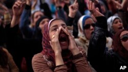 Egyptian protesters chant anti-government slogans during a rally in Tahrir Square, Cairo, Egypt, Feb. 1, 2013. 