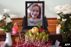 A portrait of Bui Thi Nhung, who is feared to be among the 39 people found dead in a truck in Britain, is kept on a prayer altar at her house in Vietnam's Nghe An province, Oct. 27, 2019.
