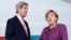 John Kerry y la jefa de Estado alemana, Ángela Merkel, este martes en Berlín.
