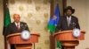 South Sudan President Salva Kiir (R) and his Sudan counterpart Omar al-Bashir hold a joint news briefing in the state house in capital Juba January 6, 2014. 