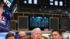 FILE - Liberty Oilfield Services Inc. CEO Chris Wright rings a ceremonial bell to celebrate the companies IPO on the floor of the New York Stock Exchange shortly after the opening bell in New York, Jan. 12, 2018.