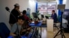 FILE - Nicaraguan journalist Hector Rosales, right, does a virtual interview from a studio-apartment used by Nicaraguan journalists in exile who report on their home country from San Jose, Costa Rica, Aug. 29, 2022. 