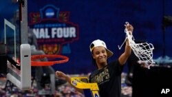 Stanford guard Kiana Williams (23) cuts down the net after the championship game against Arizona in the women's Final Four NCAA college basketball tournament, April 4, 2021, at the Alamodome in San Antonio.