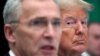 U.S. President Donald Trump reacts next to NATO Secretary General Jens Stoltenberg as they attend a working lunch during the NATO leaders summit in Watford, Britain, December 4, 2019. 