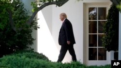 President Donald Trump walks out of the Oval Office to the South Lawn of the White House in Washington, Friday, April 28, 2017. (AP Photo/Pablo Martinez Monsivais)