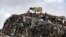 Cows are seen at the largest dump site where textile waste ends up at Old Fadama in Accra, Ghana, Oct. 19, 2024.