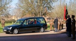 The funeral cortege of Captain Tom Moore arrives at Bedford Crematorium, in Bedford, England, Feb. 27, 2021.