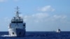 FILE - Chinese coast guard ships give chase to Vietnamese coast guard vessels (not pictured) after they came within 10 nautical miles of the Haiyang Shiyou 981, known in Vietnam as HD-981, oil rig in the South China Sea, July 15, 2014.