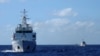 FILE - A Chinese coast guard ship is seen in the exclusive economic zone in the South China Sea, July 15, 2014.