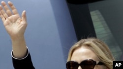 US Secretary of State, Hillary Rodham Clinton waves upon arrival in Kolkata, India, Sunday, May 6, 2012. 