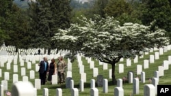 President Donald Trump and first lady Melania Trump visit Arlington National Cemetery, May 23, 2019, for the annual Flags In ceremony ahead of Memorial Day, in Arlington, Va.