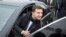 Ukrainian President Volodymyr Zelenskiy leaves the car to attend a business forum "RE:THINK. Invest In Ukraine" in Mariupol, Ukraine, Oct. 29, 2019. 