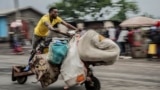 People displaced by the fighting with M23 rebels make their way to the center of Goma, Democratic Republic of the Congo, Jan. 26, 2025. 